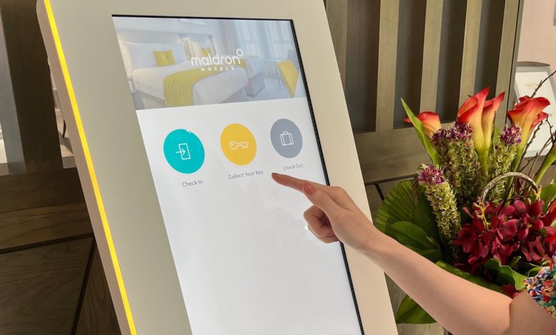 P3 puts the key into kiosk to complete contactless online check-in